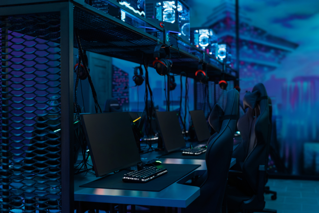 Professional gaming table with gaming PC, headset, keyboard, mouse and monitor with neon light. Professional gaming table with gaming pc, headset, keyboard, mouse and monitor with neon light.